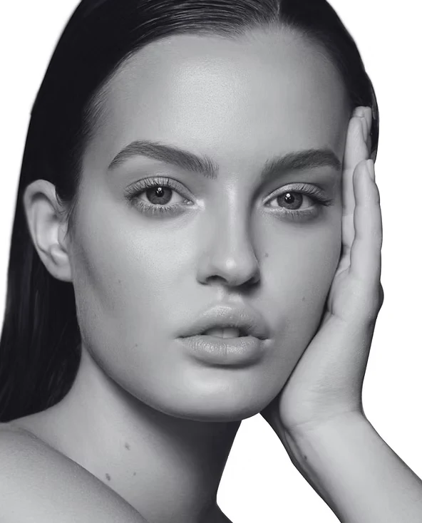 Black-and-white editorial portrait with a hand resting beside the face